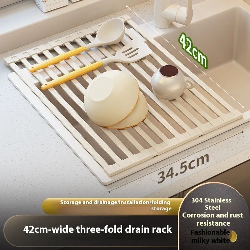 Milky white foldable stainless steel kitchen draining rack shown next to a sink.