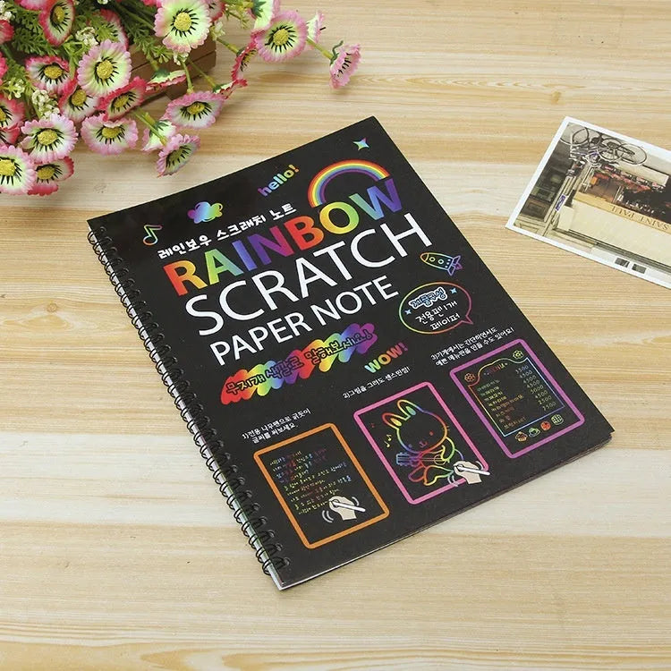 Large children's scratch art paper with colourful design revealed through scraping