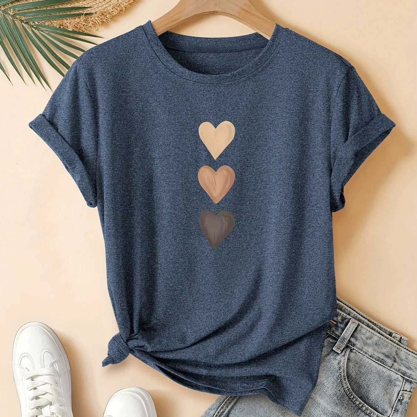 Women's art retro style printed cotton short sleeve T-shirt on a hanger.