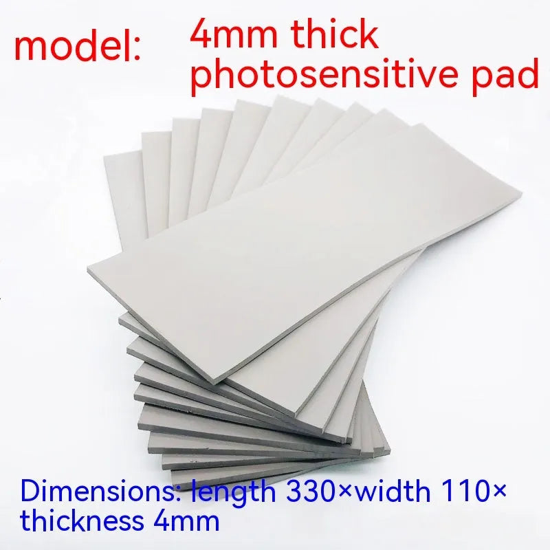 Black and grey plastic light-sensitive mat for creating seals, showing size and thickness options.