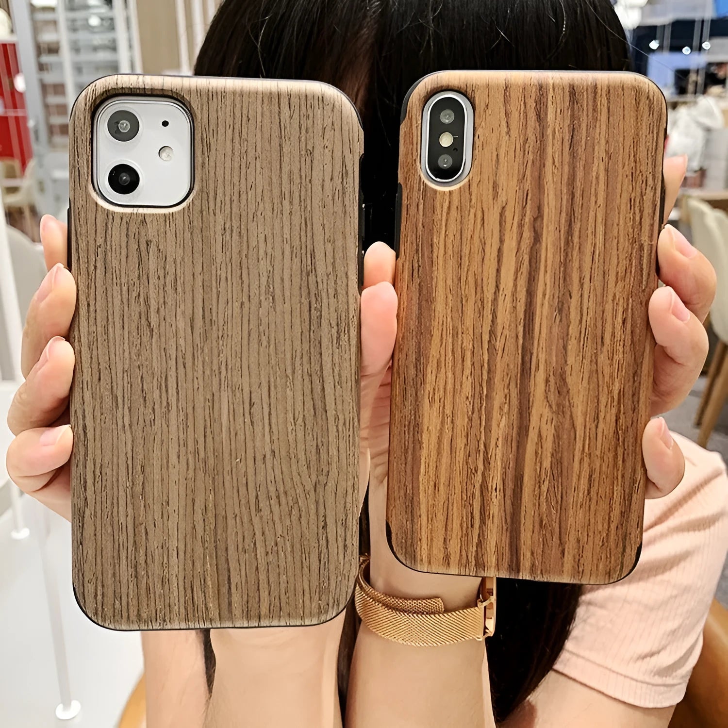 A slim wooden back cover case for an iPhone, showing the natural grain of rosewood or bamboo.