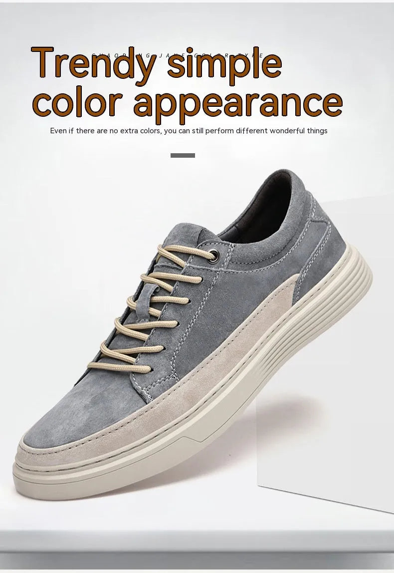 Men's grey low-top pigskin leather skate shoes with flat rubber sole and lace-up front.
