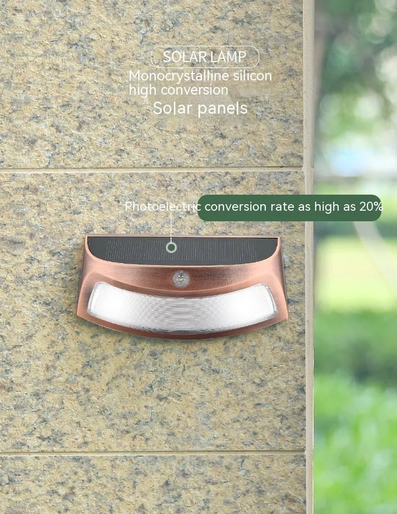 Solar-powered outdoor wall lamp with a smiling face design in warm or white light.