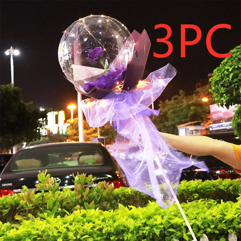 Transparent LED luminous balloon with artificial rose and built-in light, shown as a DIY bouquet kit.