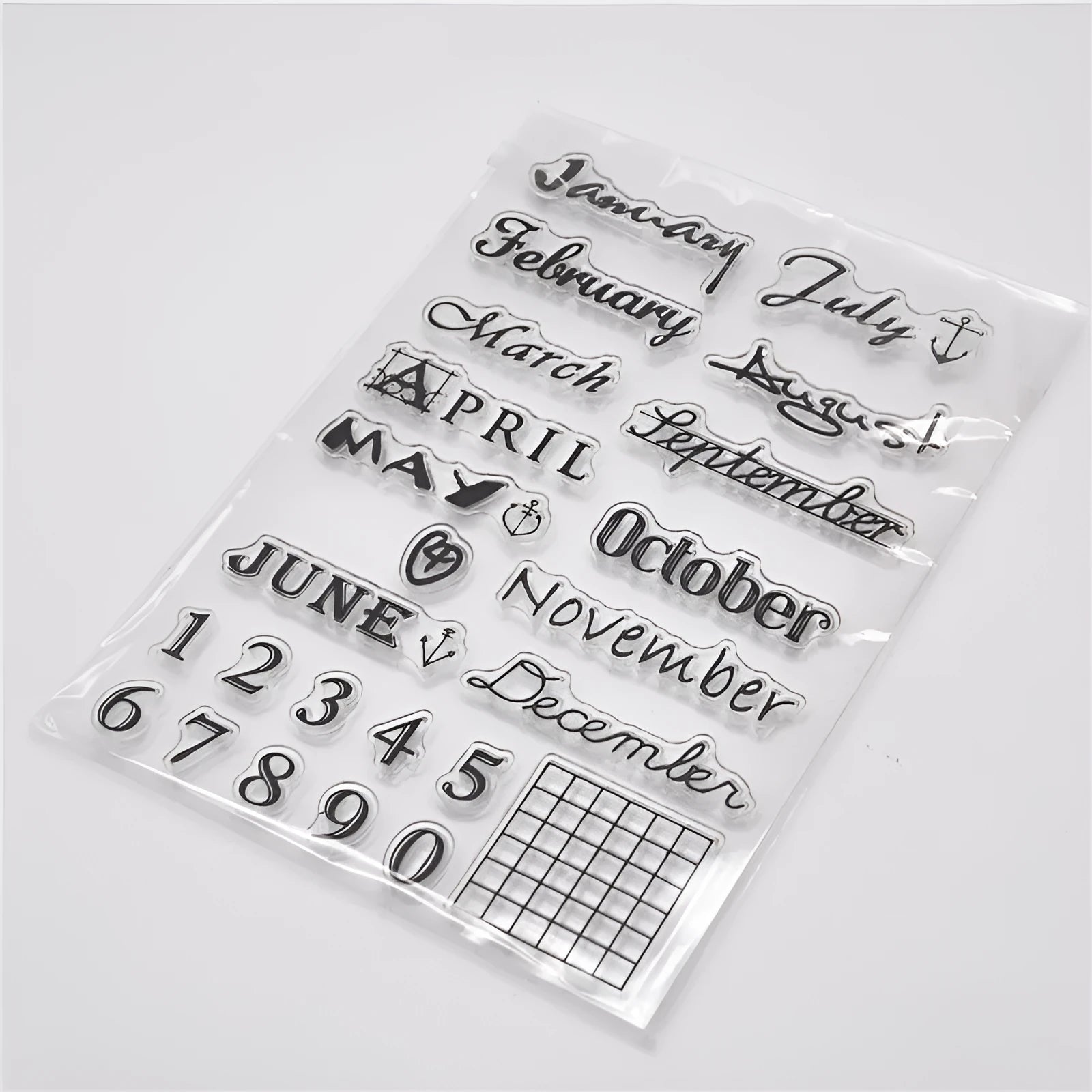 Vintage icon seal calendar stamp in transparent silicone on a crafting surface.