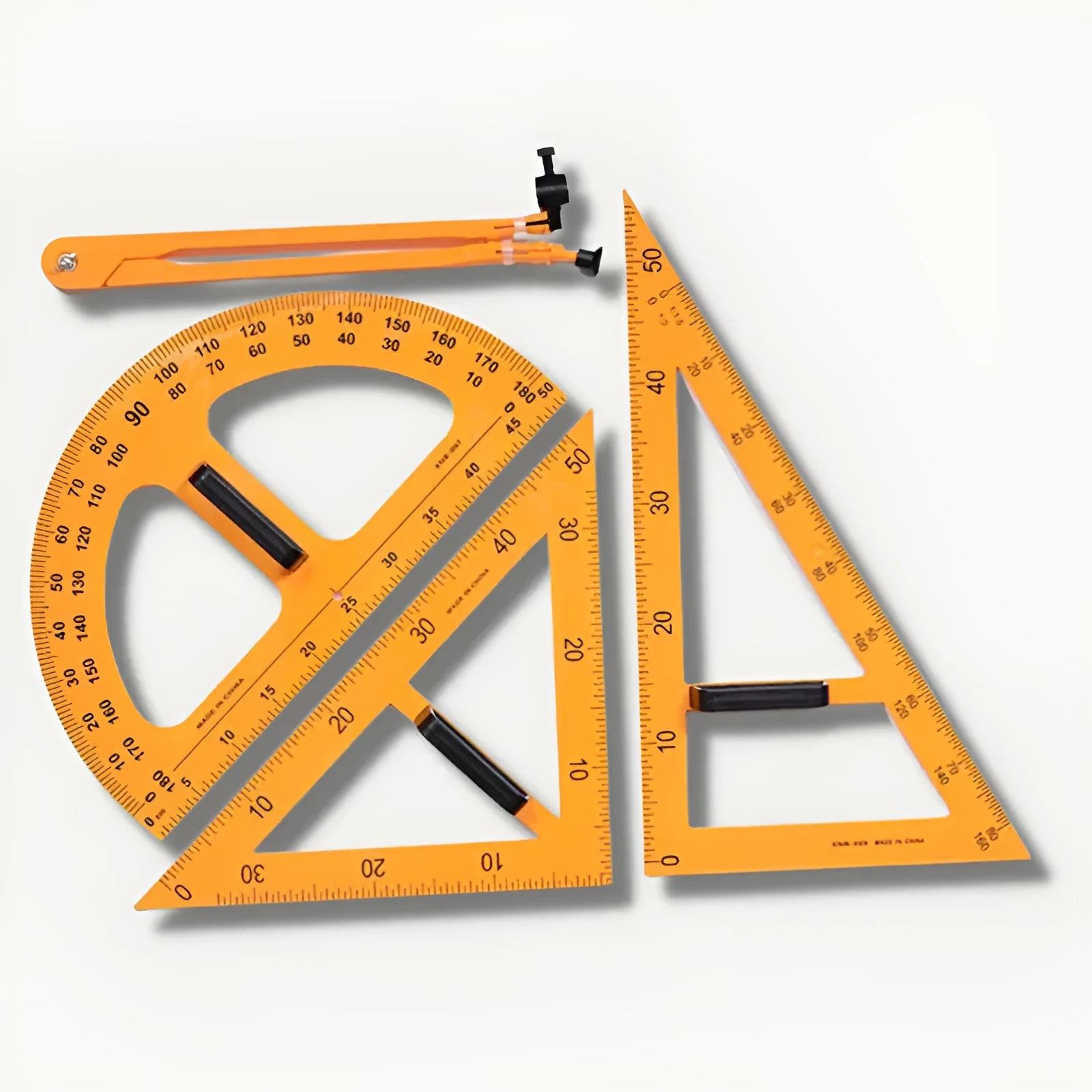 Mathematics teaching tools set with orange and black triangle rulers, protractor, and chalk compass