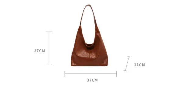 Soft leather shoulder bag in street style with sandwich pockets, shown in multiple colour options.