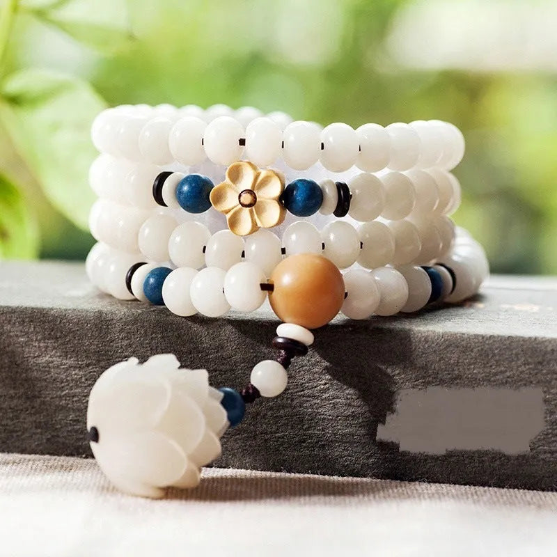 White jade Bodhi seed bracelet with 6x8mm beads showing multiple decorative style options