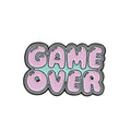 Alloy metal stereo game console badge with embossed design in multiple colour options