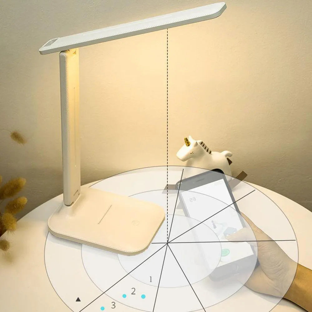 White plastic bedside lamp with touch controls for children's bedrooms