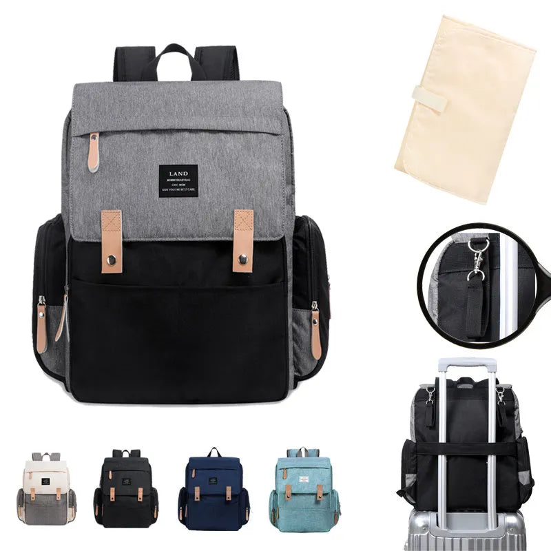LAND Mommy large Oxford cloth diaper backpack with changing mat in various colours.