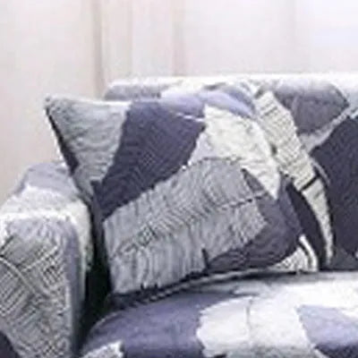 Geometric print polyester sofa slipcover stretched over sofa with matching pillowcase