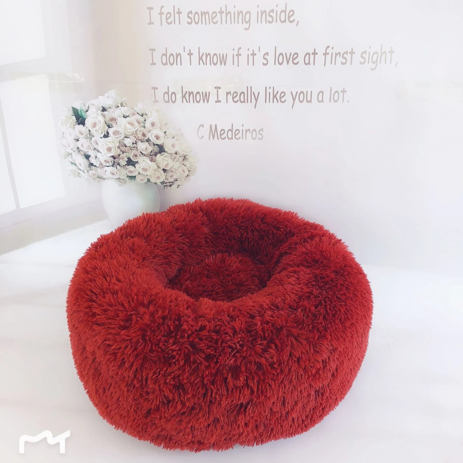 Plush pet nest in apricot colour on floor, soft cloth circular dog bed 40cm diameter indoor use