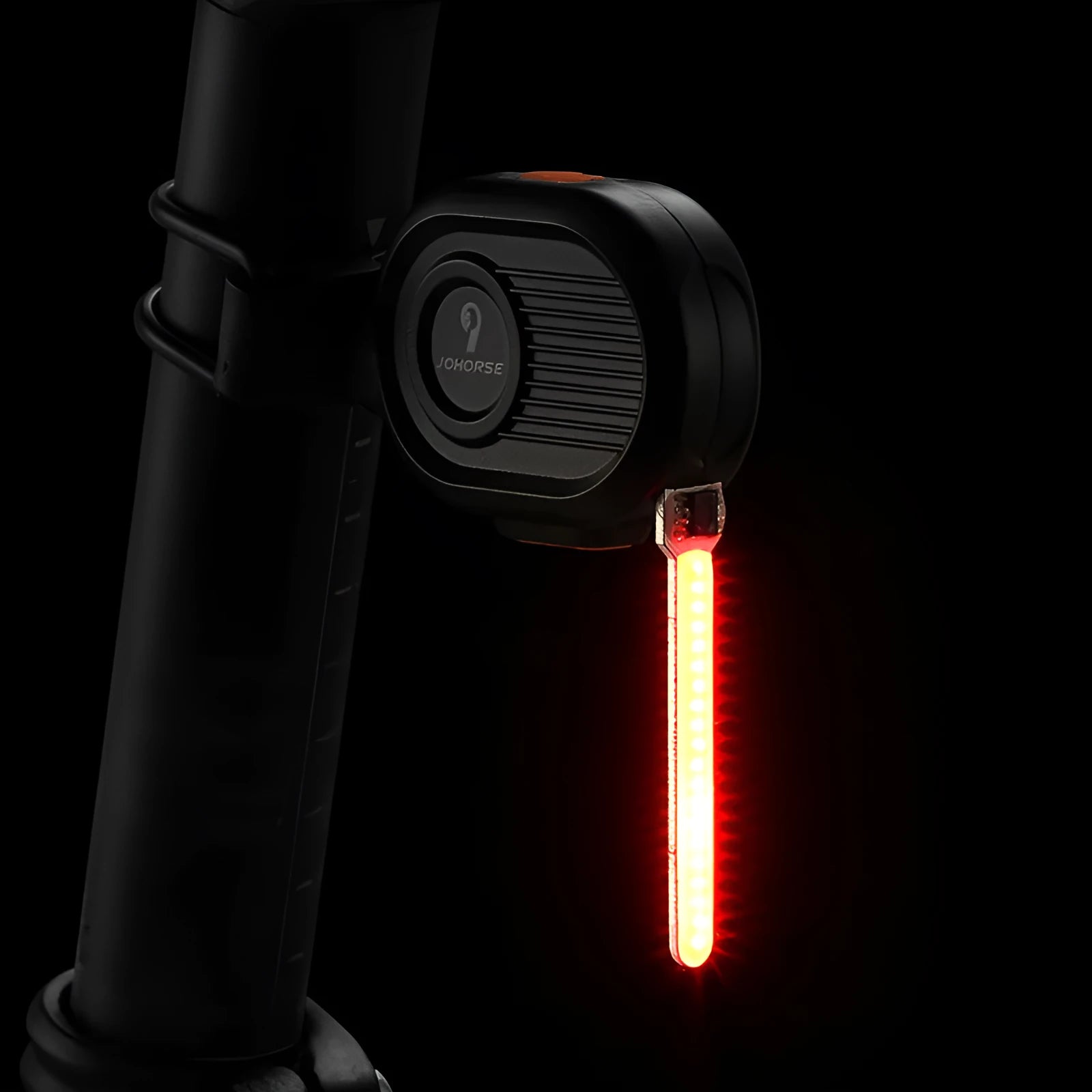Bicycle taillight with colourful running water LED light effect mounted on a bike seat post.