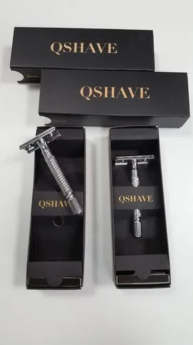 Chrome double edged safety razor with butterfly opening mechanism and storage box.