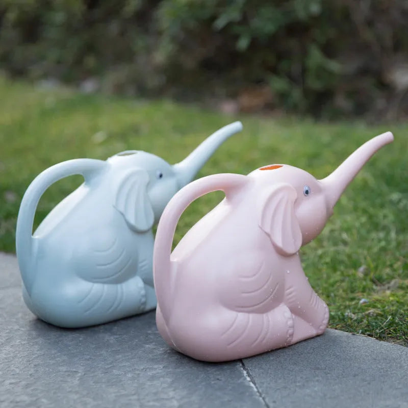 Pink elephant-shaped children's watering can with a long nozzle and bottle-style handle.