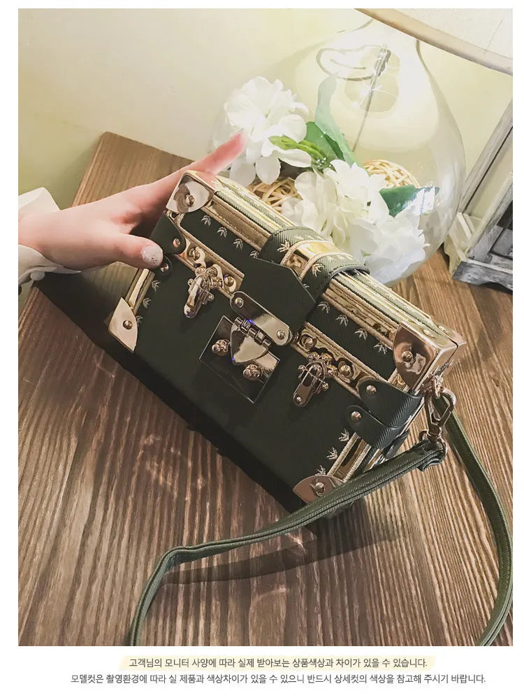 Hard-case women's shoulder bag with flap design, rivet decoration, and adjustable crossbody strap
