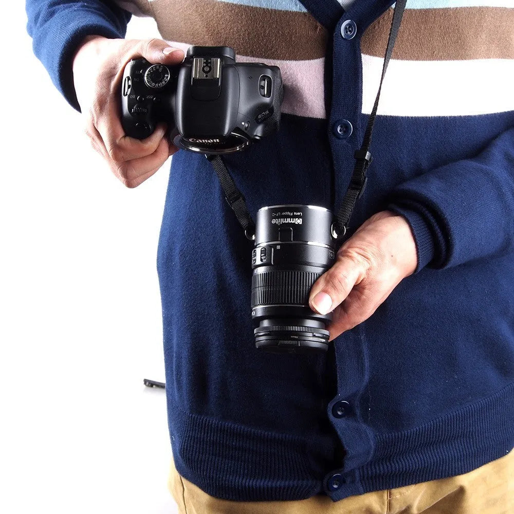 Aluminium lens flipper for Nikon E-Mount cameras with cotton shoulder strap showing double lens holder design