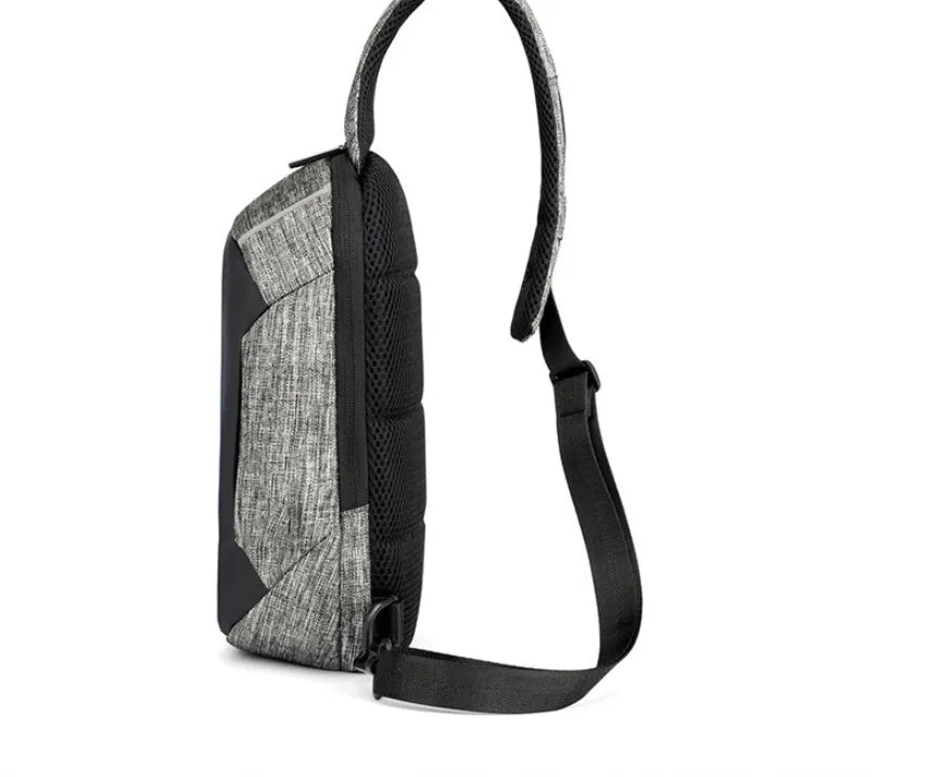 Small dark blue oxford cloth waterproof chest bag with a single strap and zipper.