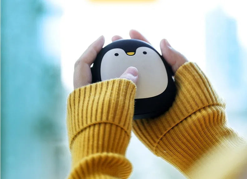 Cartoon penguin polar bear USB rechargeable hand warmer power bank showing black, white, and black-white colour options