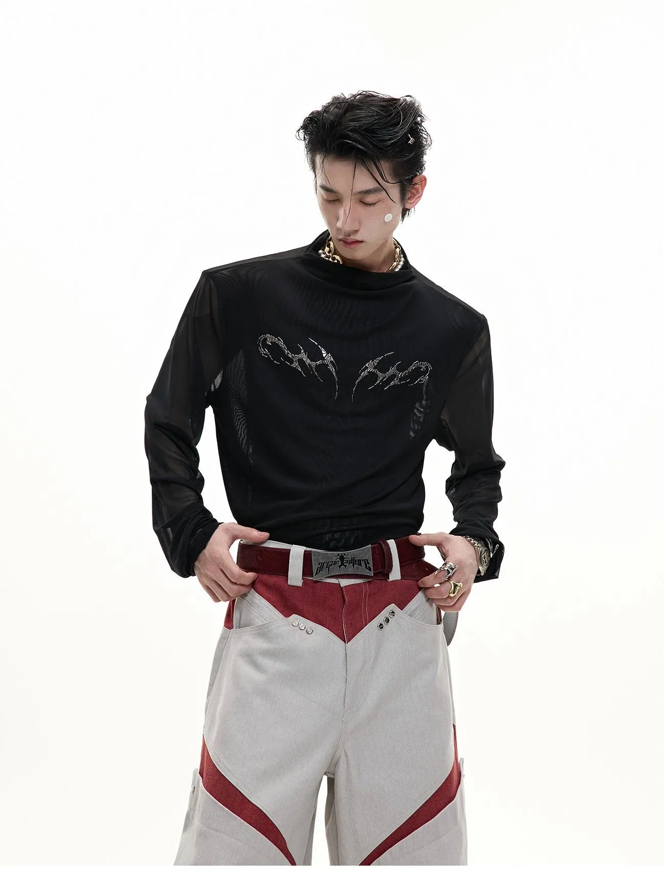 Men's black slim-fit mesh long-sleeve bottoming shirt laid flat, showing texture.