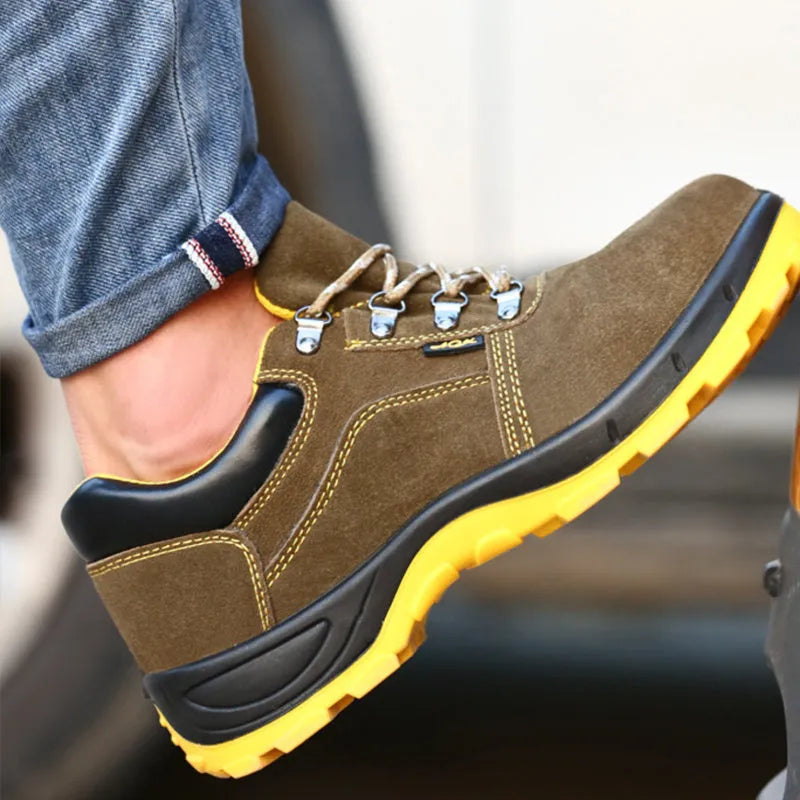 Bronze coloured low-cut steel toe safety boots with a cowhide suede upper and solid rubber sole.