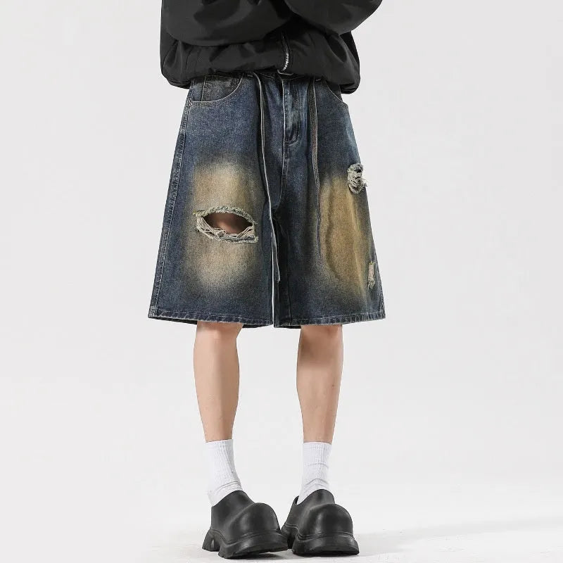 Retro blue loose fit jeans with ripped detailing in cotton denim fabric