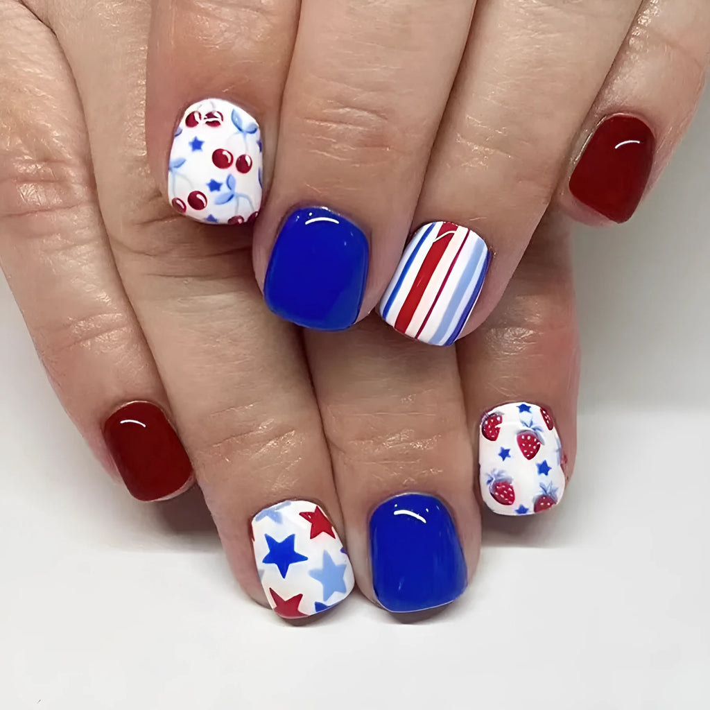 Short glossy red and blue nail stickers with strawberry and cherry pattern, 24 pieces.