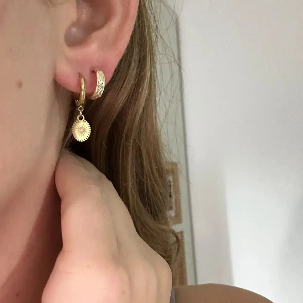 Stainless steel geometric earrings with ellipse shape and ear button closure in colour XY-EH005