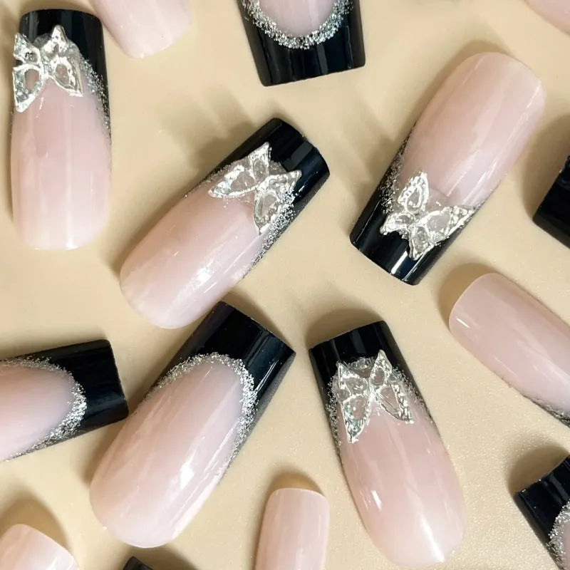 French-style false nails with glitter butterfly pattern and flash details on medium-length thin nails
