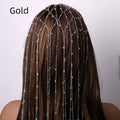 Gold metallic mesh headband with rhinestones and a dangling tassel decoration.