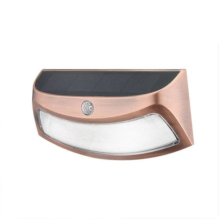 Solar-powered outdoor wall lamp with a smiling face design in warm or white light.