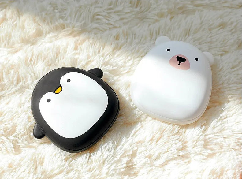 Cartoon penguin polar bear USB rechargeable hand warmer power bank showing black, white, and black-white colour options