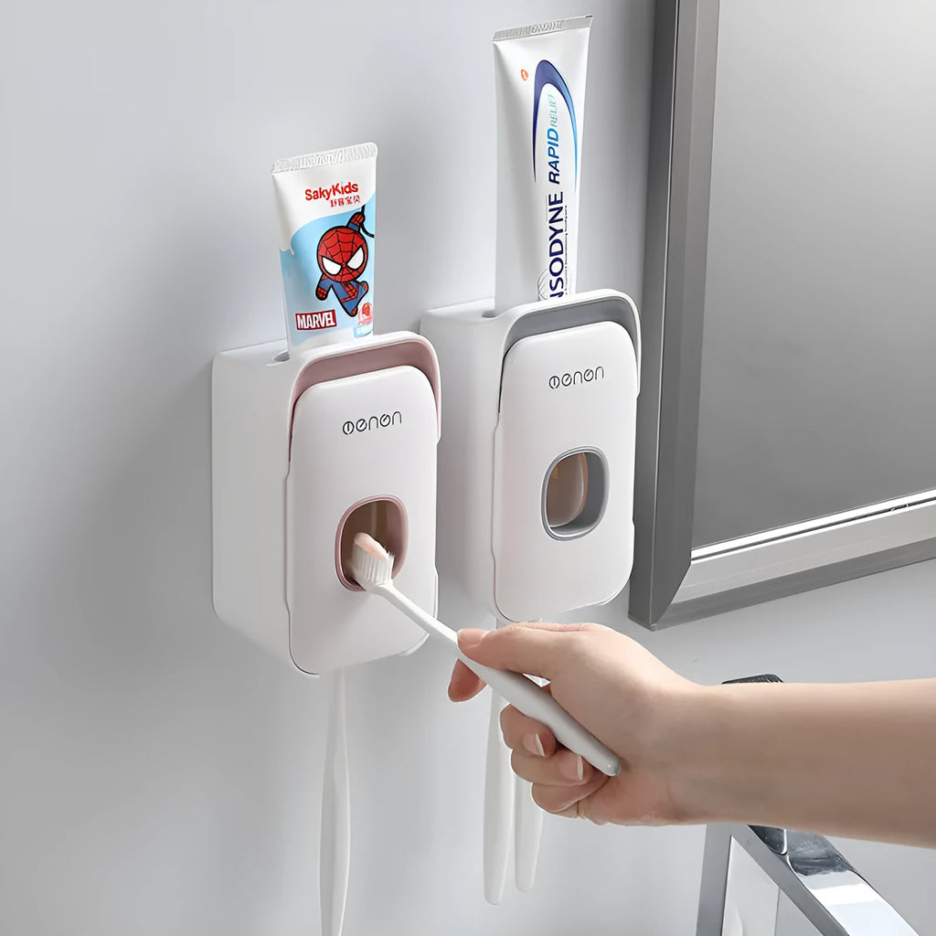 Automatic toothpaste dispenser mounted on bathroom wall in blue colour
