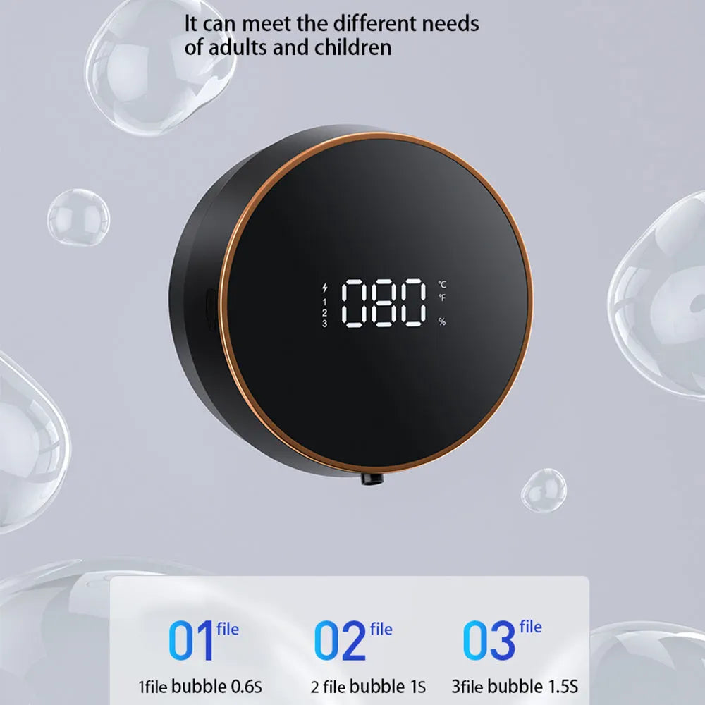 Black automatic sensor soap dispenser mounted on a white bathroom wall, dispensing foam.