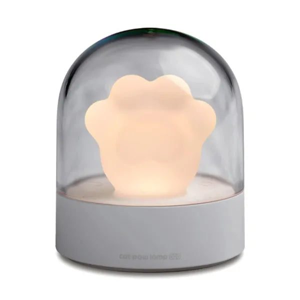 Grey or pink cat paw shaped USB rechargeable night light with musical functions on wooden desktop