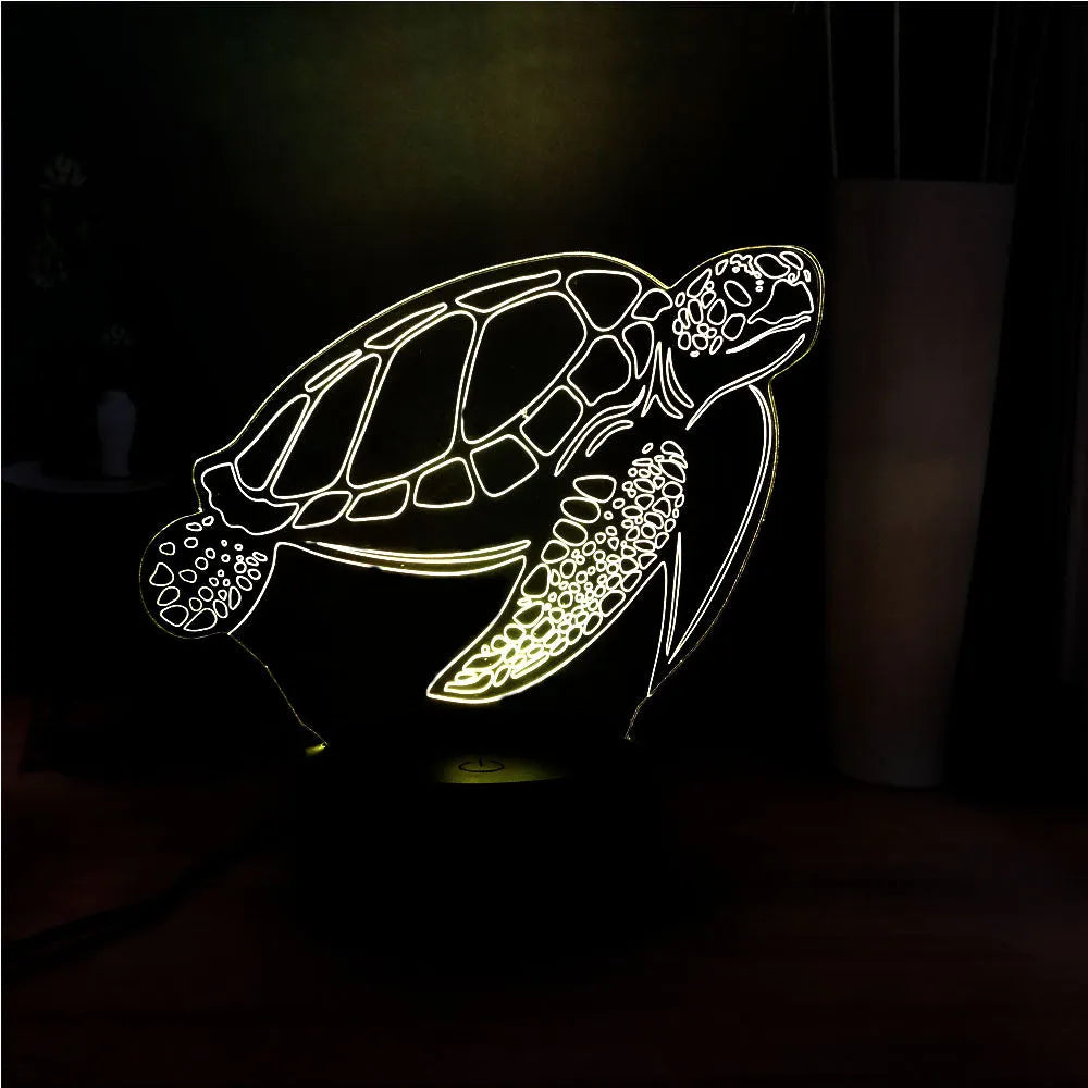 3D green turtle shaped LED night light glowing with multi-colours on a wooden table.