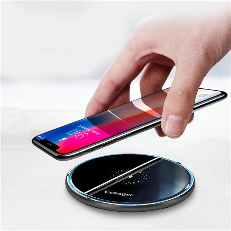 Black and white aluminium wireless charger showing LED indicator lights and anti-slip surface