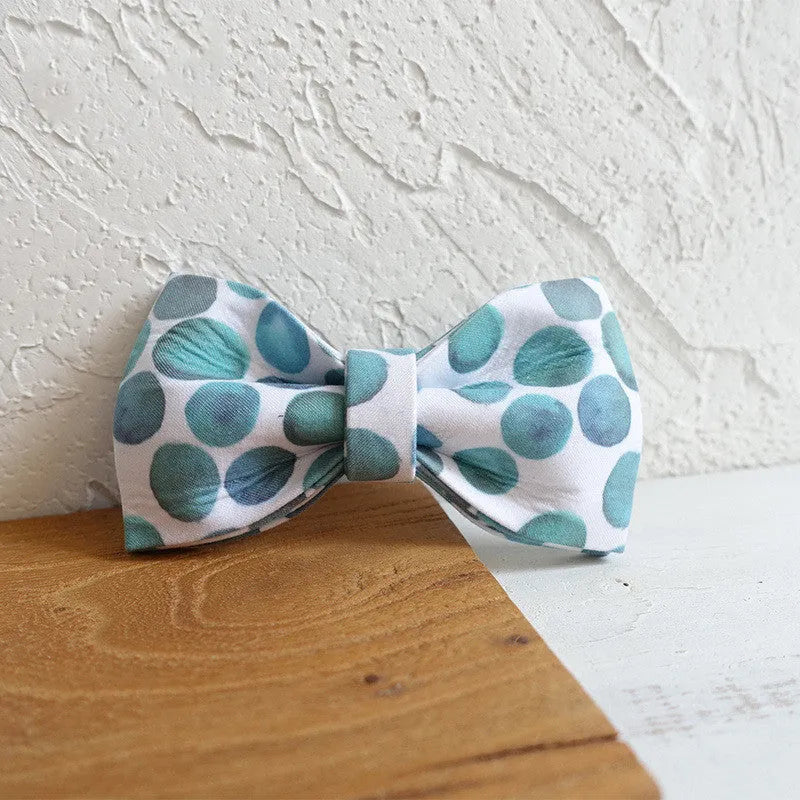 Polyester pet bow collar jewellery in bubble colour on a light background showing size options XS to XL