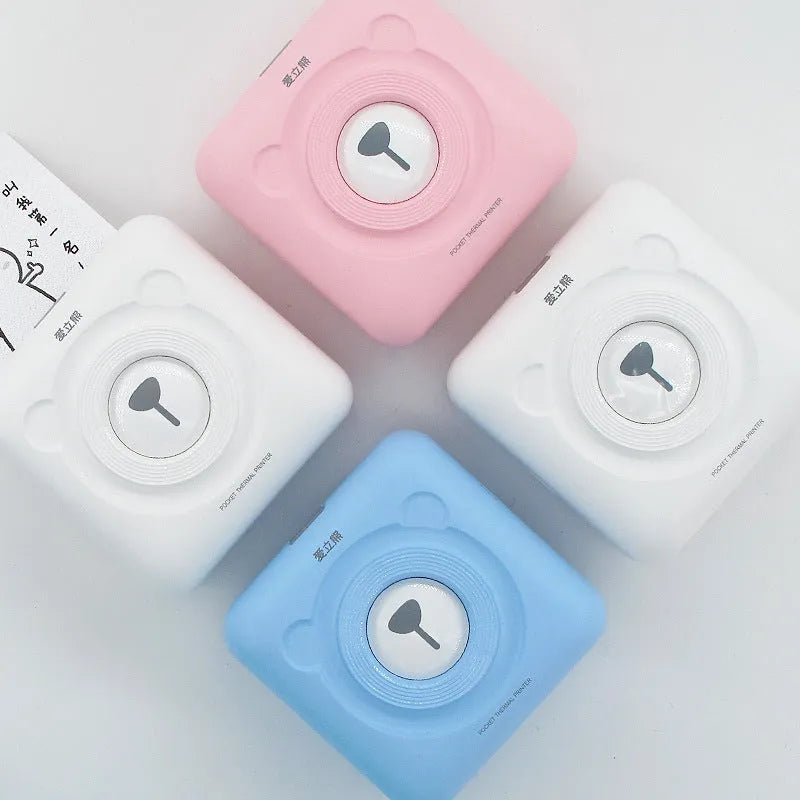 Portable mini thermal label printer in white, 7.9 x 7.9 x 4.2cm, with rechargeable battery and thermal paper roll