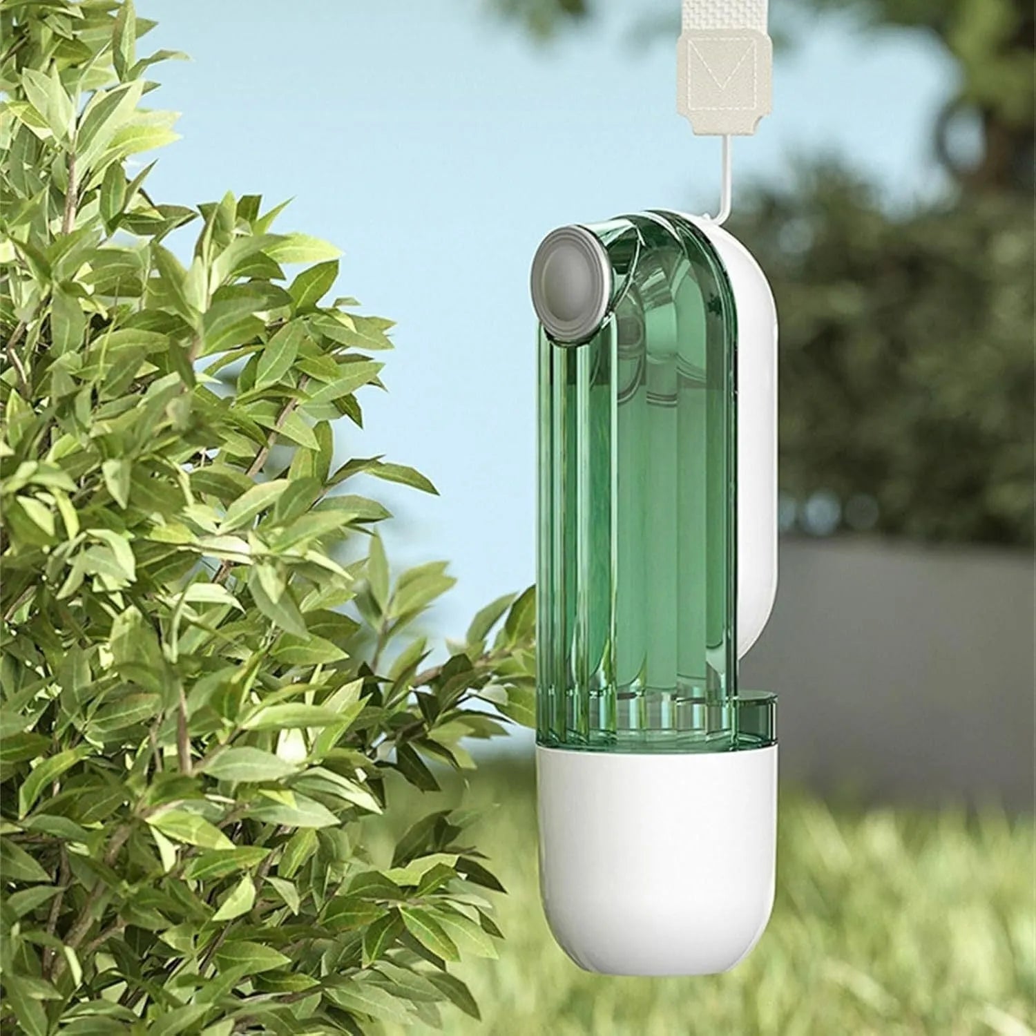 Beige foldable dog water bottle with food container, showing dispenser tray and compact size.