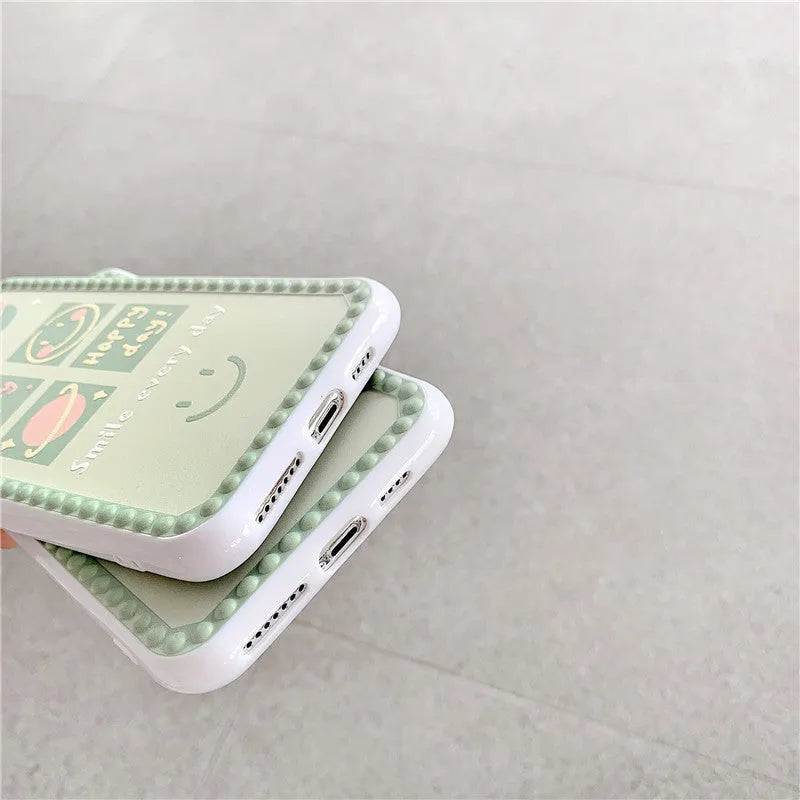 Green TPU iPhone case with geometric pattern and smiley faces in a polka dot frame for multiple models.