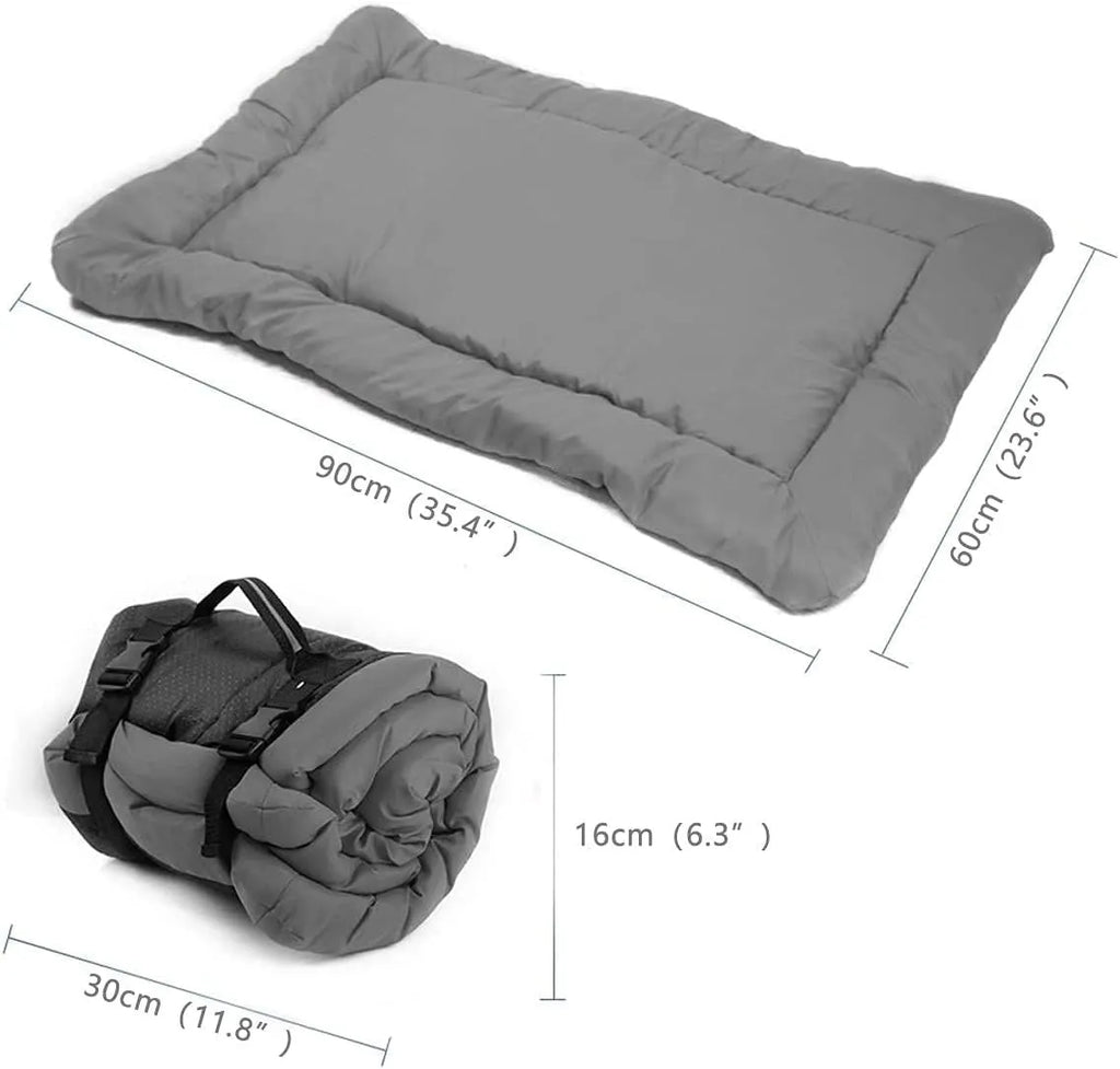 Blue folded portable dog bed with nylon buckles next to an unfolded bed on grass.