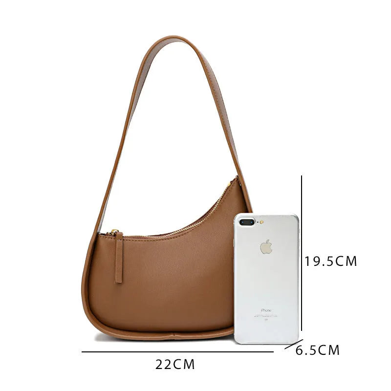 Small half moon shaped leather shoulder bag with wide strap in four colour options