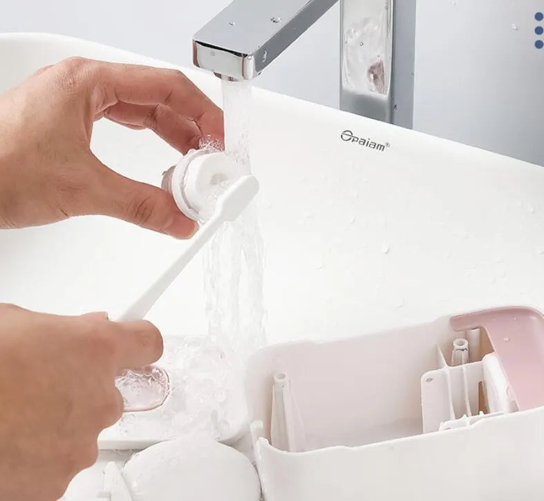 Automatic toothpaste dispenser mounted on bathroom wall in blue colour