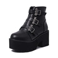 Black women's gothic punk ankle boots with a large bat-shaped buckle and a side zipper.