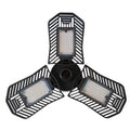 A foldable industrial LED garage flood light with a die-cast aluminum body, shown in a workshop setting.