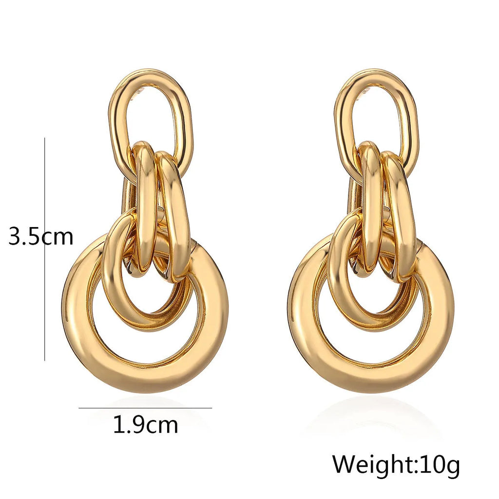 Geometric copper earrings with gold colour finish in irregular shape