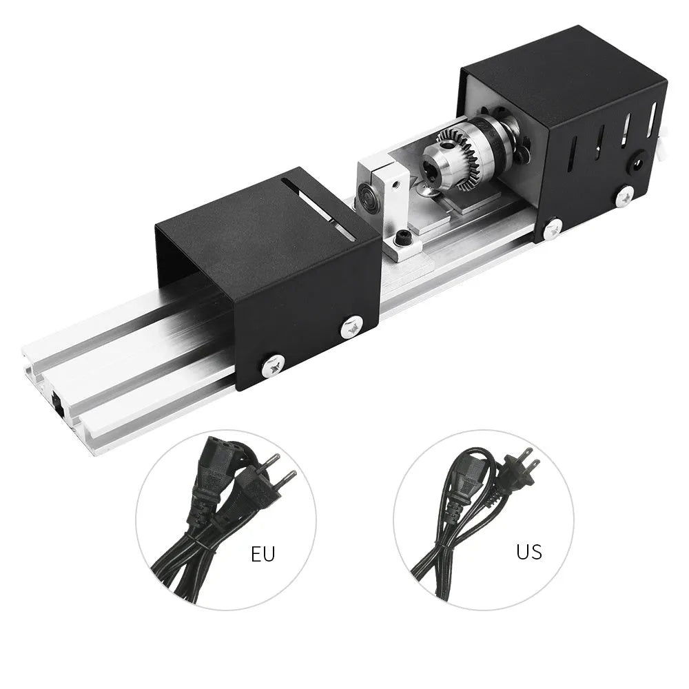 Silver metal mini manual woodworking lathe with carving knives on a workbench.