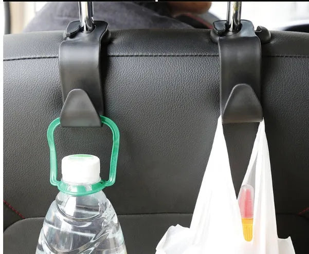 Set of 4 black PP universal car seat back hooks, each 11cm x 3.5cm, with 20kg weight capacity, for hanging bags from car front seat backs